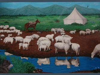 A mural of sheep near some water