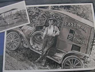 A man leaning against an Eastman vehicle