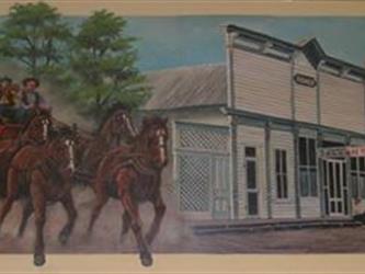 A mural of a horse drawn carriage going past a building