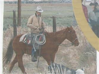 A mural of a rancher on a horse herding a cow