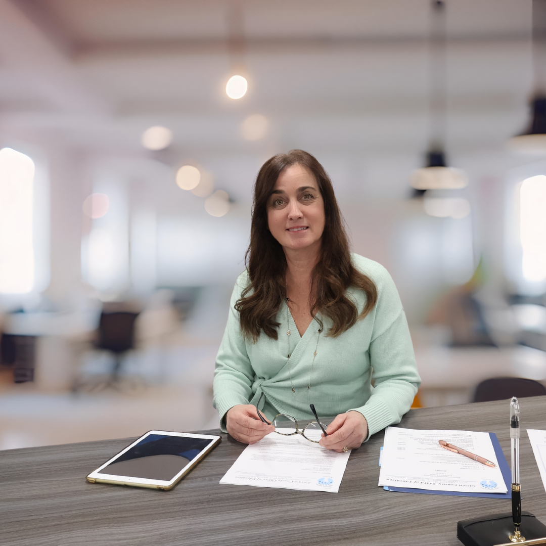 A photo of Patricia Hagata working at the LCOE office. 